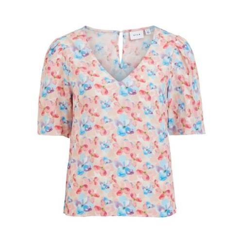 Blusa estampada con cuello de pico y manga corta