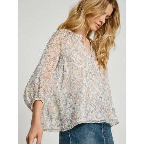 Blusa vaporosa estampada