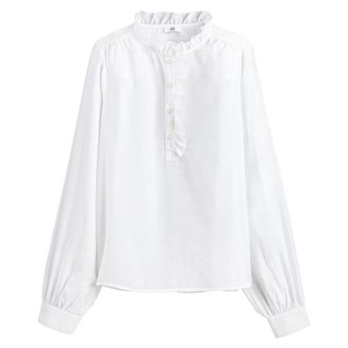 Blusa de cuello alto con volantes de manga larga